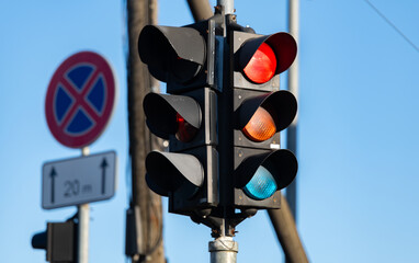 Red traffic light in the city street