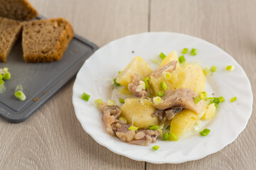 Potatoes and herring with green onions