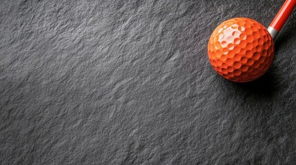 A top view of a putter and two golf balls resting on vibrant green grass, offering a perfect opportunity for design or text additions