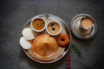 Homemade Triangle Dosa served with chutney sambar idli and vada | South Indian vegetarian breakfast