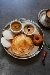 Homemade Triangle Dosa served with chutney sambar idli and vada | South Indian vegetarian breakfast