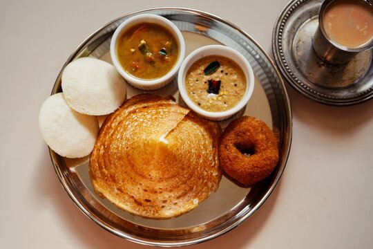 Homemade Triangle Dosa served with chutney sambar idli and vada | South Indian vegetarian breakfast