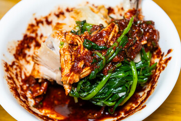 boiled chicken and chives covered with spicy sauce