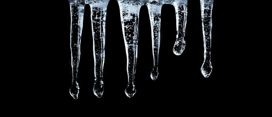 Melting ice form creates glistening water droplets in contrast with black backdrop