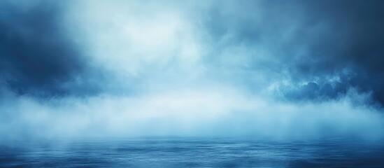 Obraz premium Abstract blue landscape with clouds and mist over calm water surface Copy Space