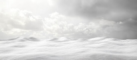 Obraz premium Barren desert landscape featuring rippled white dunes under dramatic gray clouds, empty foreground for text, wide-angle perspective.