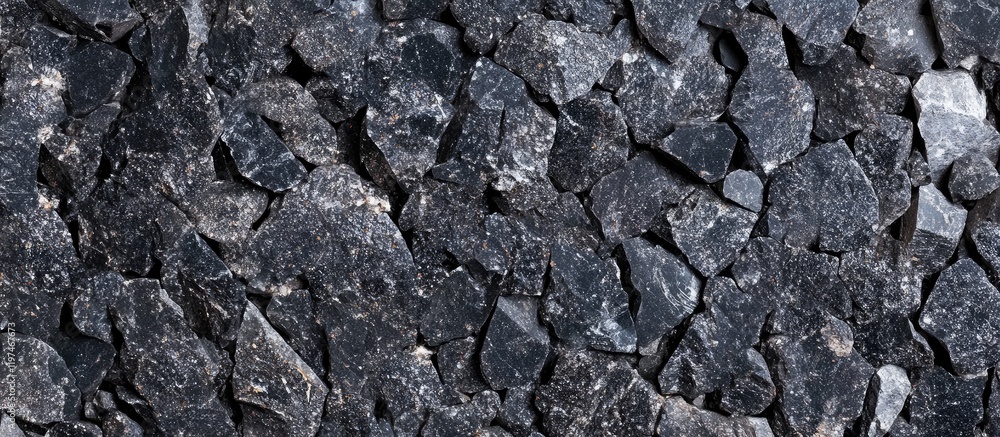 Poster close up macro shot of black granite surface with gray stone texture ideal for banner background and