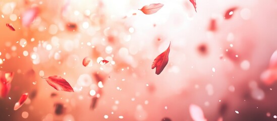 Obraz premium Soft focus background with falling rose petals and bokeh light effects in warm pink and orange tones with ample copy space