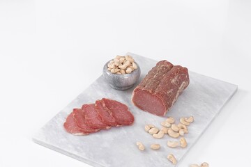 Meat homemade delicacies dry-cured on a light background