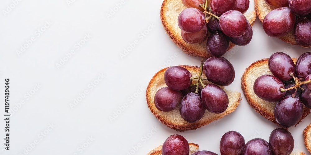 Aufkleber red grapes on toasted bread slices arranged on a white background with copy space