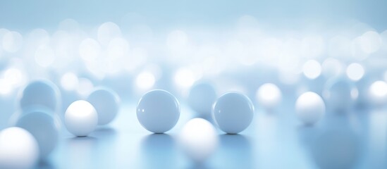 Abstract background with white spheres on a soft blue surface illuminated by blurred lights and containing copy space for text.