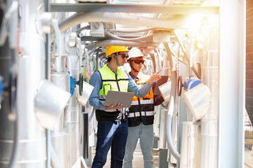 Group of Asian male engineer worker working in sewer pipes area at construction site. Male engineer...