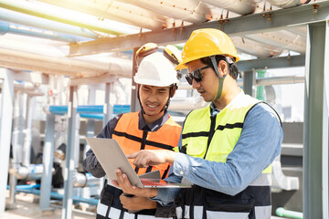 Group of Asian male engineer worker working in sewer pipes area at construction site. Male engineer...