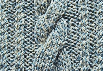 Soft light blue wool crossed cable ornament texture as background