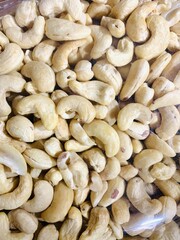 Full frame top view of huge amount of raw tasty cashews