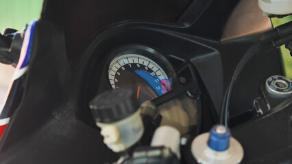 Close up of a motorcycle dashboard. Sports motorcycle dashboard with tachometer up to 12 thousand...