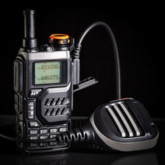 Portable two-way radio with short UHF antenna and microphone