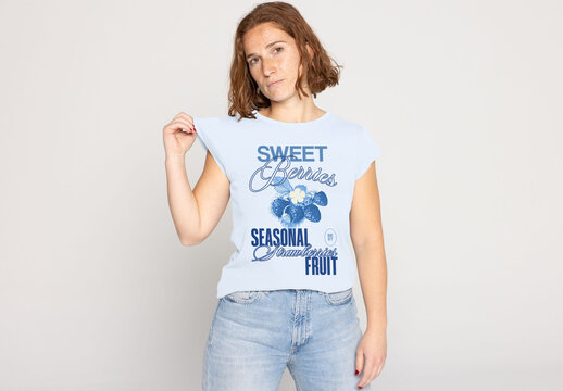 Mockup of a Woman Wearing a Plain White T-Shirt With Jeans