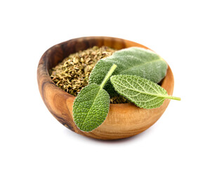 sage leaf and powder in wooden bowl