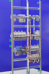 The reverse side of the electrical switchboard. The connected wires are tied with plastic ties.