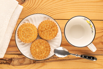 Chocolate cookies with homemade kitchen utensils, close-up, top view and isolated on white background.