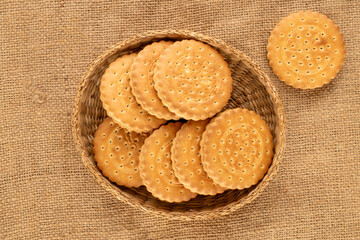 Chocolate cookies with homemade kitchen utensils, close-up, top view and isolated on white background.