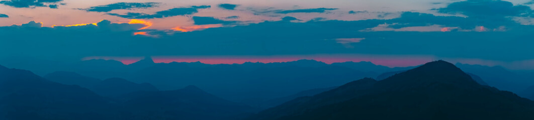 High resolution stitched alpine sunset summer panorama or sundowner at Alpenrosenbahn Westendorf,...
