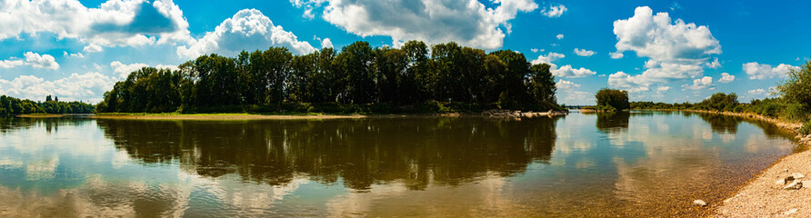 Summer view with reflections in river Danube at Straubing, Bavaria, Germany