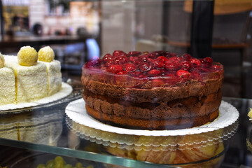 Chocolate cake with raspberries in a cafe