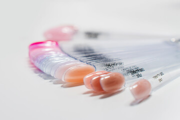 Close-up of a gel nail color palette featuring a variety of shades,