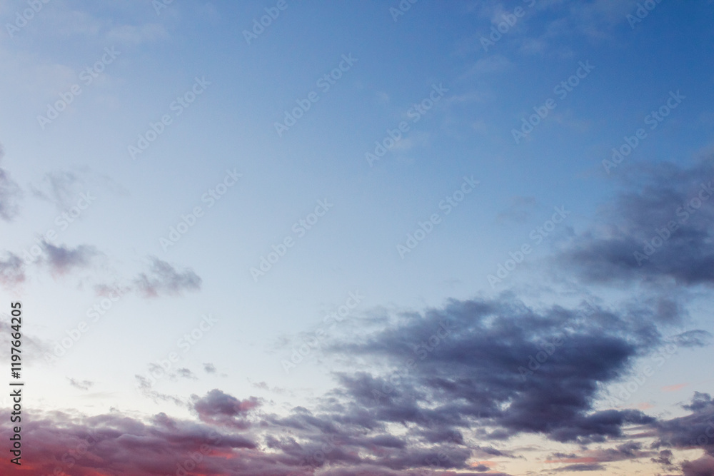 Wall mural clouds on the sky at twilight. heavy air pressure. beautiful nature background in colorful light at 