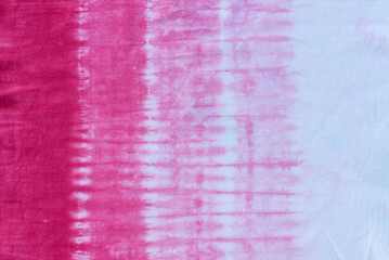pink tie dye pattern hand dyed on cotton fabric abstract background.
