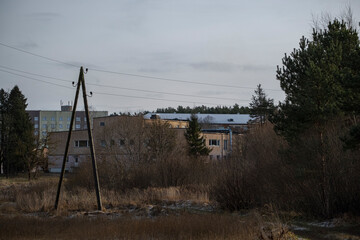 old soviet houses between trees in Latvia. Kandava town, late autumn