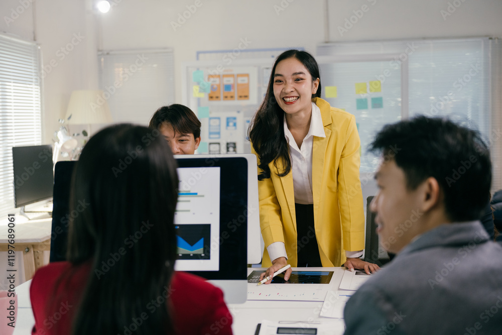 Poster young asian businesspeople discussing project strategy together during a meeting in a modern office.