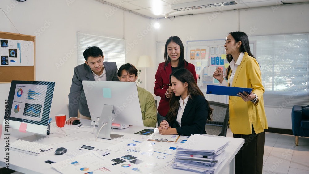 Poster five asian businesspeople working together in modern office, analyzing charts and graphs on computer