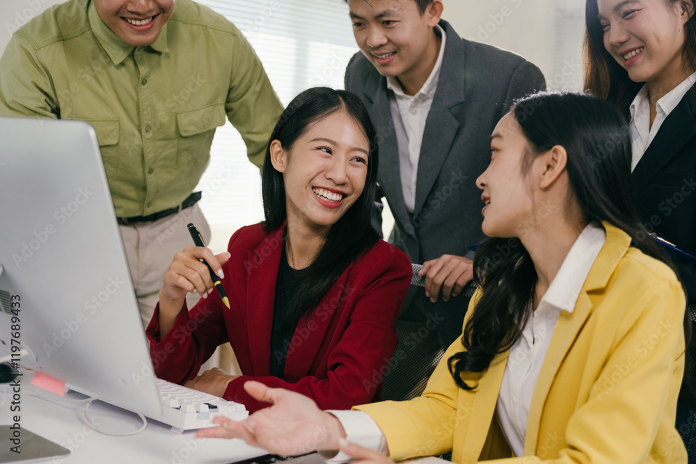 Poster asian businesspeople engaged in a project discussion while collaborating over a computer in the offi