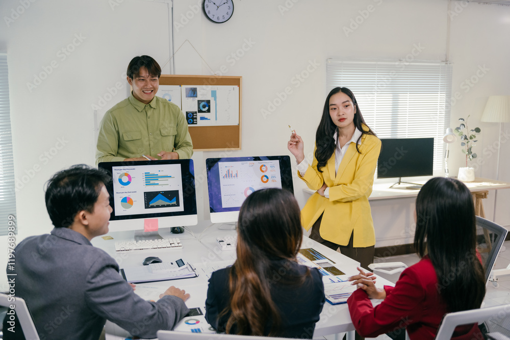 Aufkleber group of young asian businesspeople having a discussion and working together using data displayed on