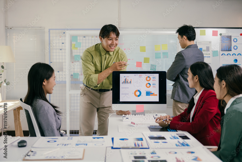 Poster asian businesspeople are having a productive meeting in a modern office, using charts, graphs, and a