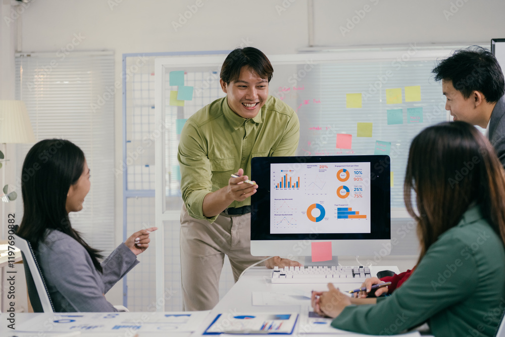 Aufkleber group of young asian businesspeople collaborating in a modern office, discussing financial charts an