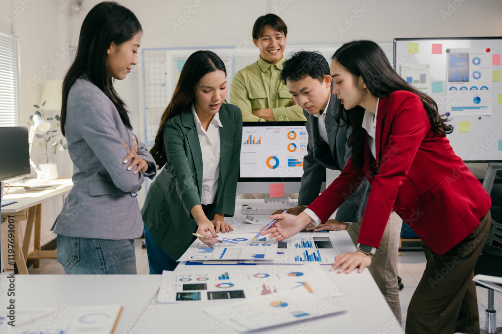 Poster business team analyzing financial charts and reports during a productive meeting in a modern office,