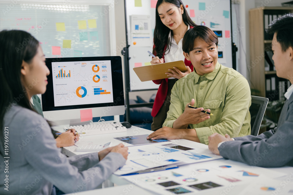 Poster Business team discussing financial report using charts and graphs on computer screen and printed documents, analyzing company performance and planning strategies for growth