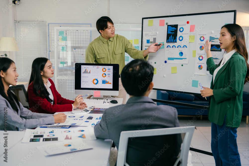 Poster two asian business people pointing at whiteboard and computer screen showing graphs and charts, pres