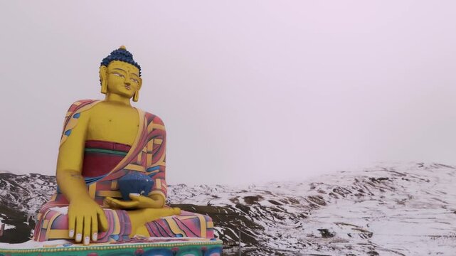 Majestic Buddha statue seated in meditation, vibrant statue of buddha on the snow mountains in langza