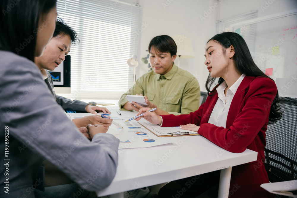 Poster asian business team reviewing marketing data and analyzing charts on a document, working together to