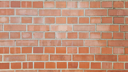 The red brick walls are brittle with age