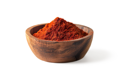 Dried and ground paprika powder on wooden bowl on a transparent background