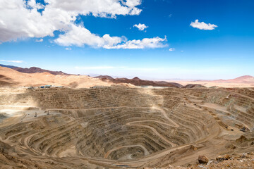 View from above of the pit of an open-pit copper mine in Chile