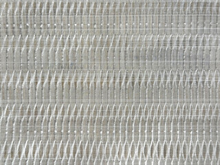 Close up photo of beautiful white woven fabric texture. Synthetic fabric art in layered ellipse or...