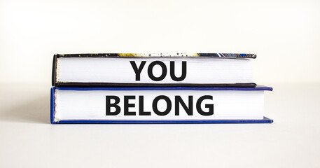 Belonging and you belong symbol. Concept words You belong on beautiful books. Beautiful white background. Business belonging and you belong concept. Copy space.