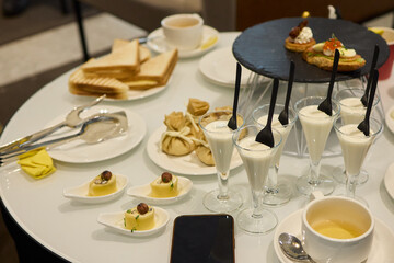 An Elegant Assortment of Gourmet Desserts and Savory Snacks Beautifully Arranged on Table